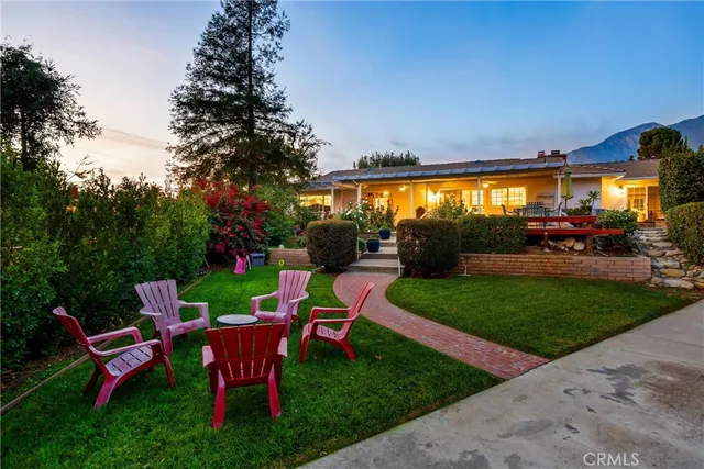 a view of a backyard with sitting area