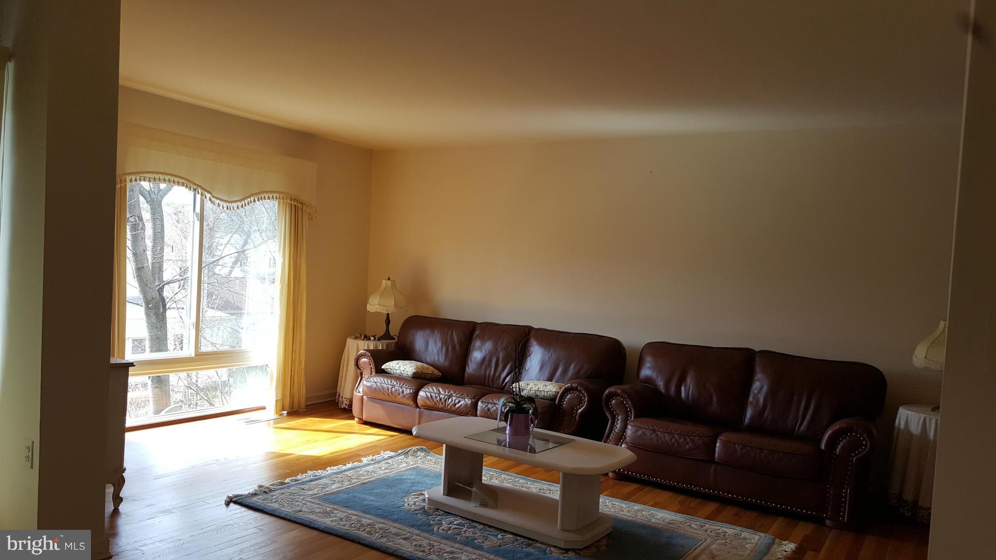 8152 Inverness Ridge Road Potomac, MD 20854 - Photo 7 of 7 a living room with furniture and a window