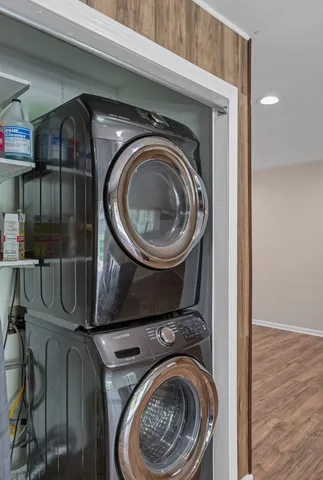 a utility room with mirror dryer and washer