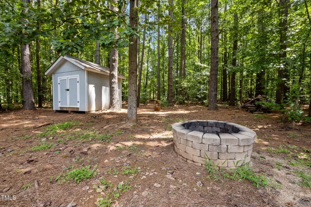 a view of a backyard with a trees
