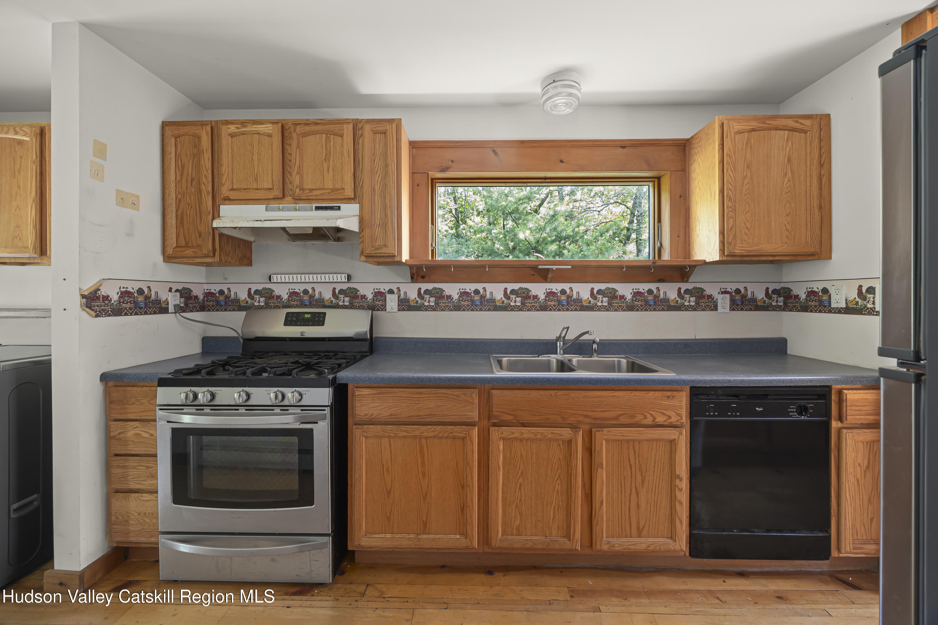 117 Spring Street Craryville, NY 12521 - Photo 12 of 31 a stove top oven sitting inside of a kitchen