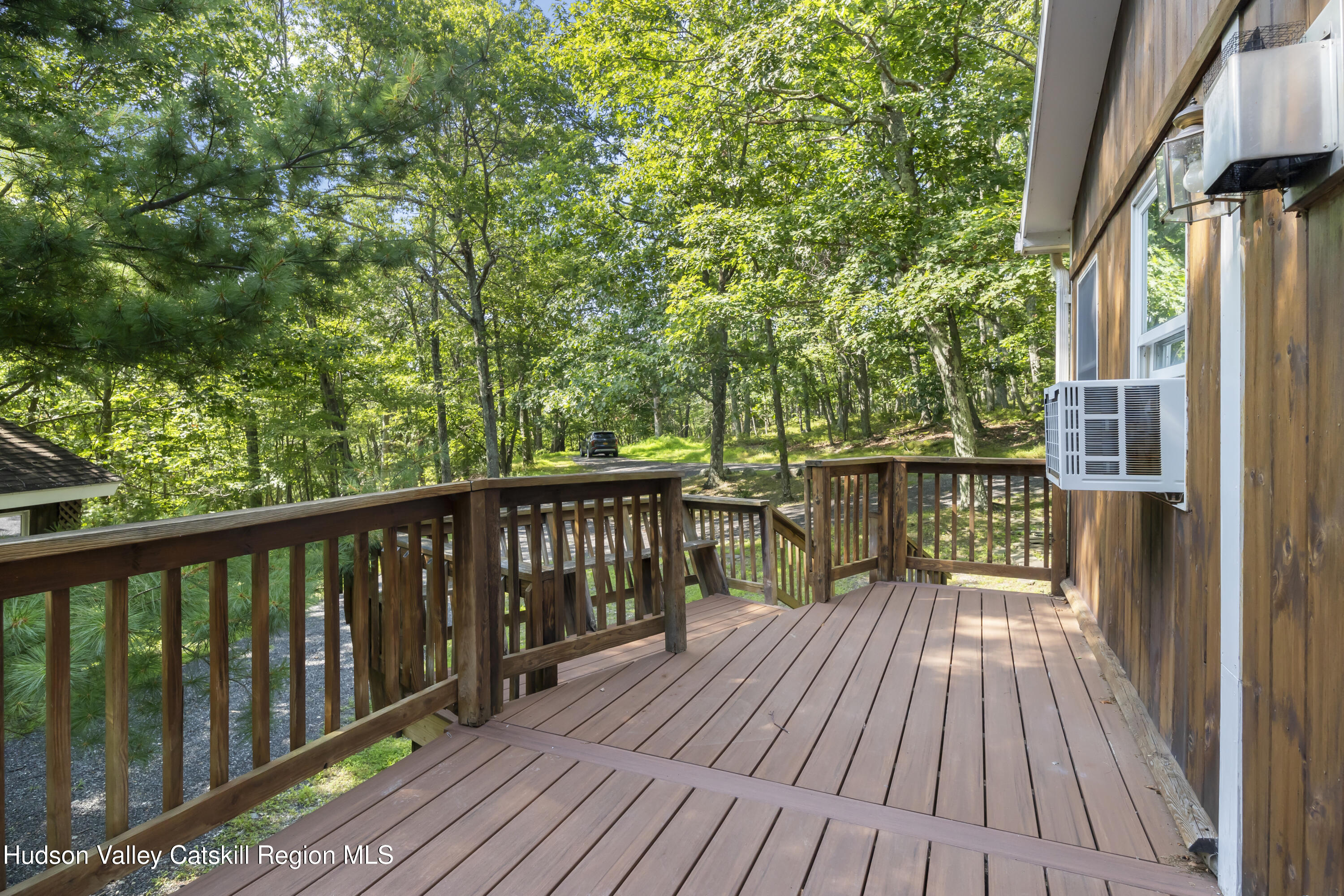 117 Spring Street Craryville, NY 12521 - Photo 22 of 31 a view of balcony with wooden floor and fence