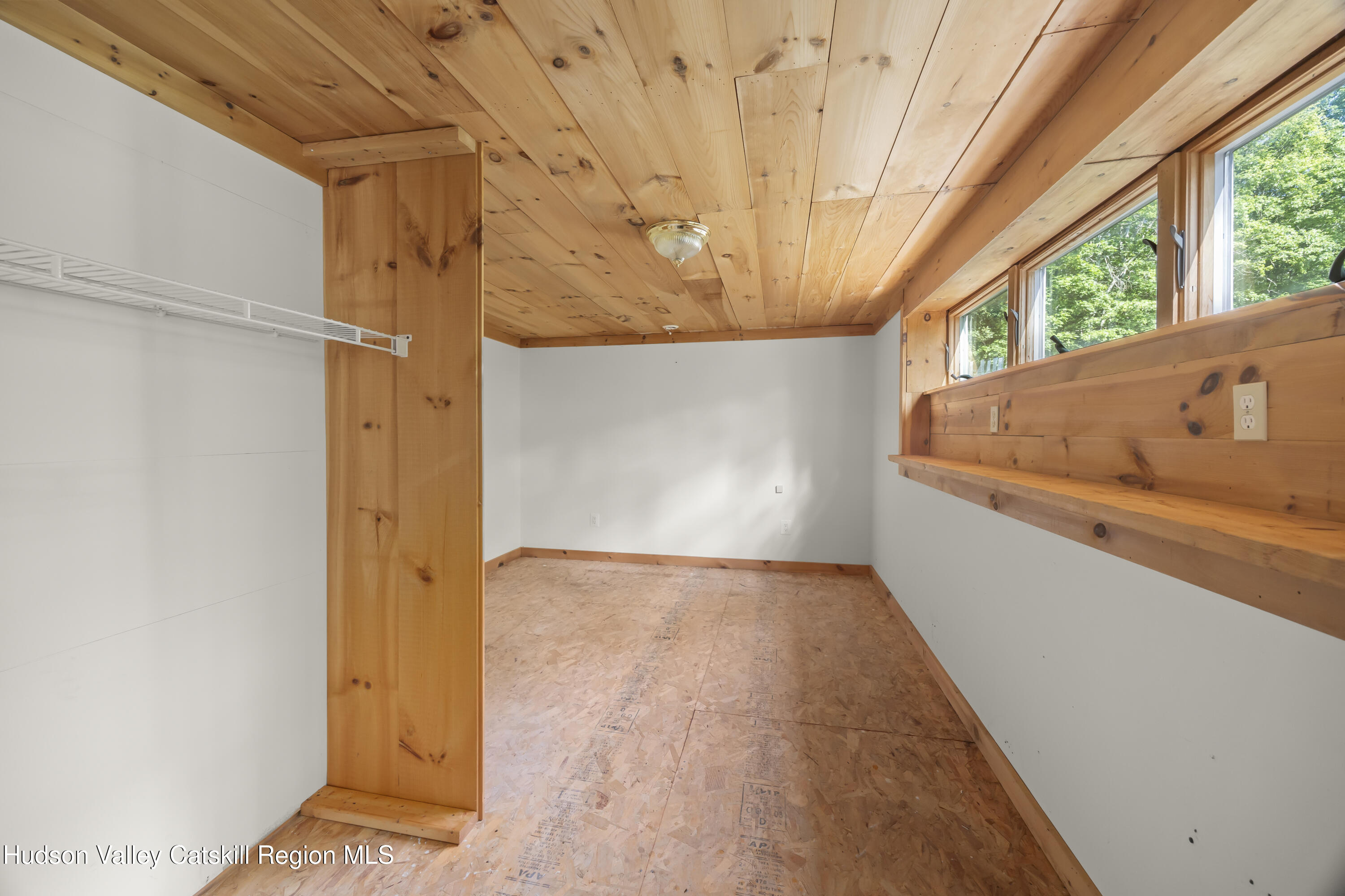 117 Spring Street Craryville, NY 12521 - Photo 24 of 31 a view of an empty room with a window