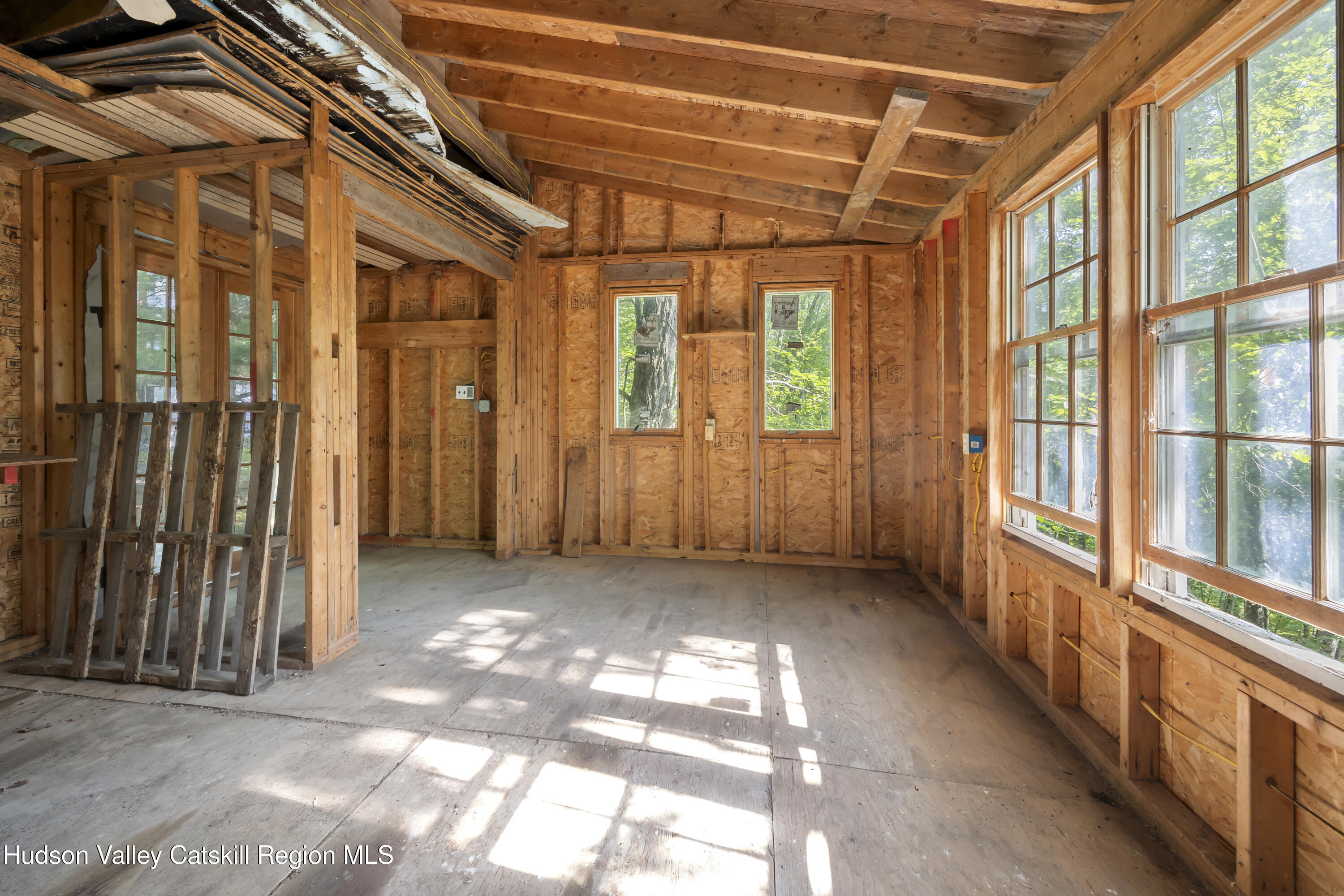 117 Spring Street Craryville, NY 12521 - Photo 27 of 31 a view of a porch with wooden floor and stairs