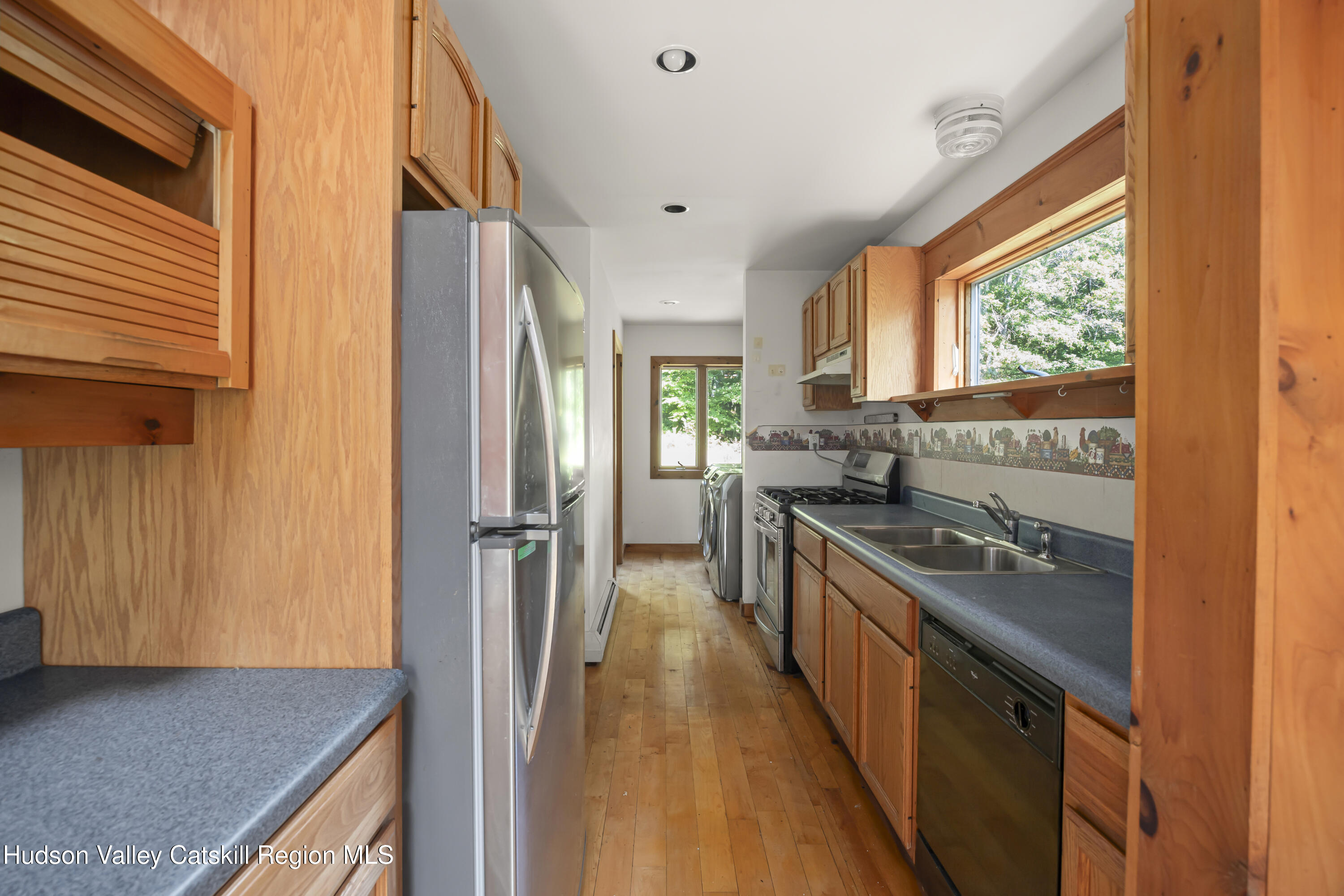 117 Spring Street Craryville, NY 12521 - Photo 31 of 31 a kitchen with stainless steel appliances granite countertop a refrigerator a stove and a sink