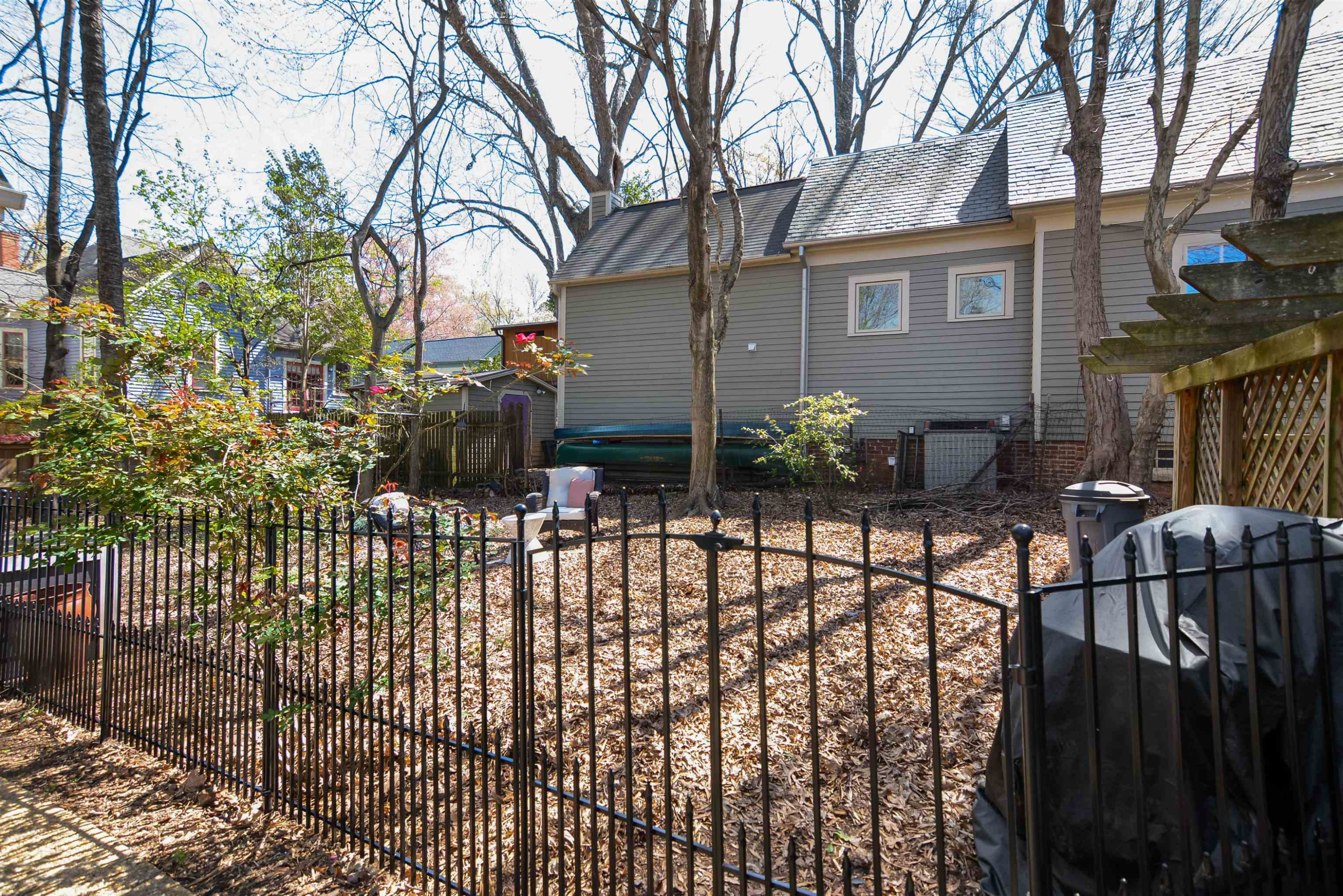 520 North Bloodworth Street Raleigh, NC 27604 - Photo 25 of 30 a view of a house with a small yard and wooden fence