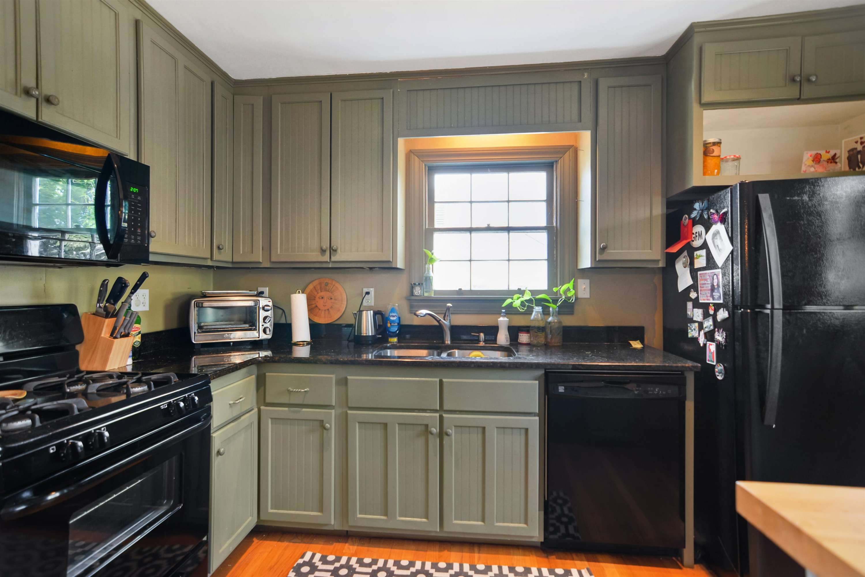 520 North Bloodworth Street Raleigh, NC 27604 - Photo 8 of 30 a kitchen with stainless steel appliances granite countertop a refrigerator and a stove top oven