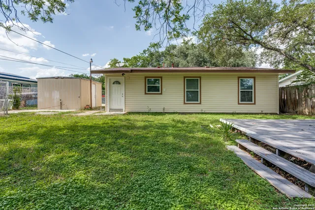 a backyard of a house with lots of green space