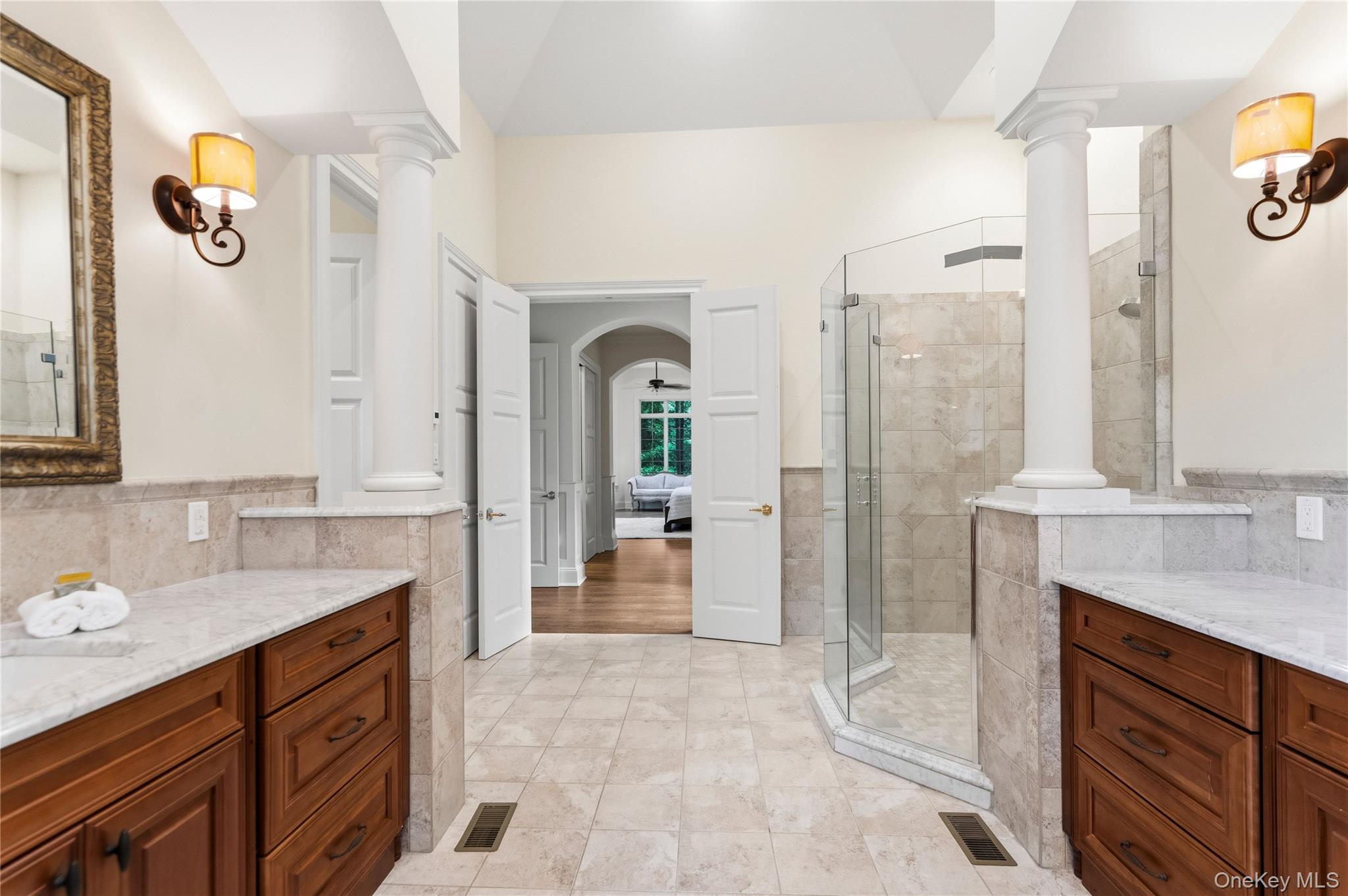 1960 Midlane Road South Syosset, NY 11791 - Photo 28 of 46 a spacious bathroom with a granite countertop sink mirror and shower