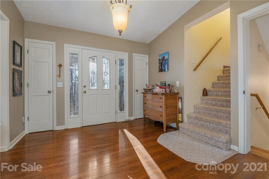 301 Willow Pond Road Rutherfordton, NC 28139 - Photo 13 of 42 a view of entryway with wooden floor and stairs
