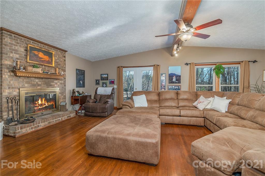 301 Willow Pond Road Rutherfordton, NC 28139 - Photo 16 of 42 a living room with furniture and a fireplace