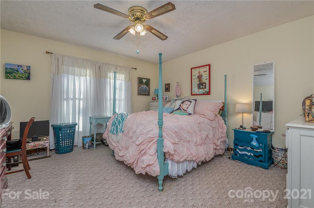 301 Willow Pond Road Rutherfordton, NC 28139 - Photo 31 of 42 a bed room with a bed and a chair