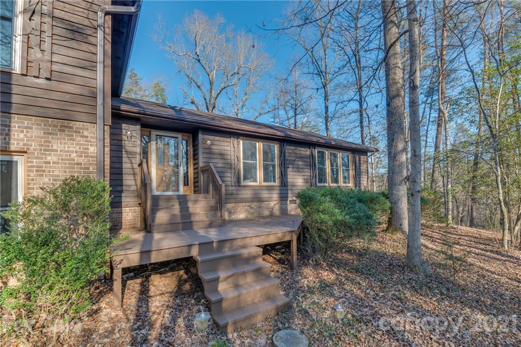 301 Willow Pond Road Rutherfordton, NC 28139 - Photo 6 of 42 a view of roof deck with table and chairs and potted plants