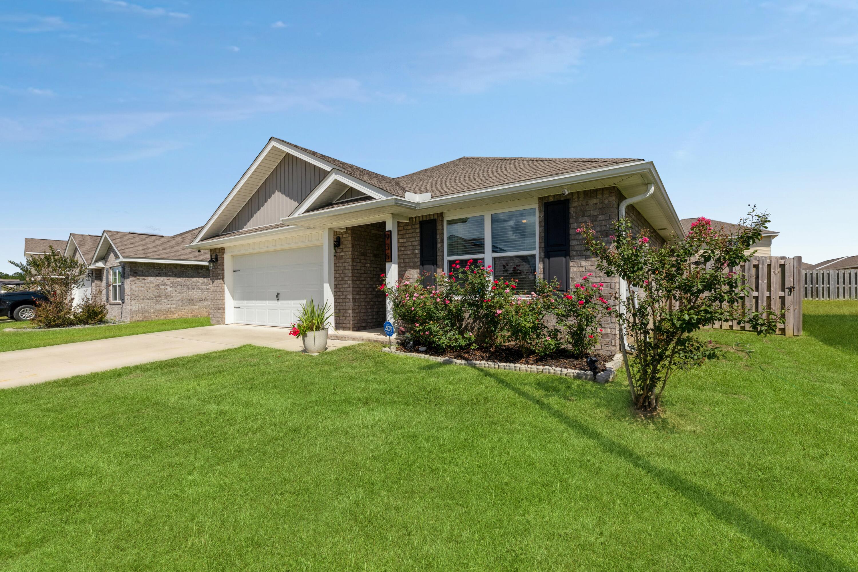 936 Merganser Way Crestview, FL 32539 - Photo 2 of 39 a house view with a garden space