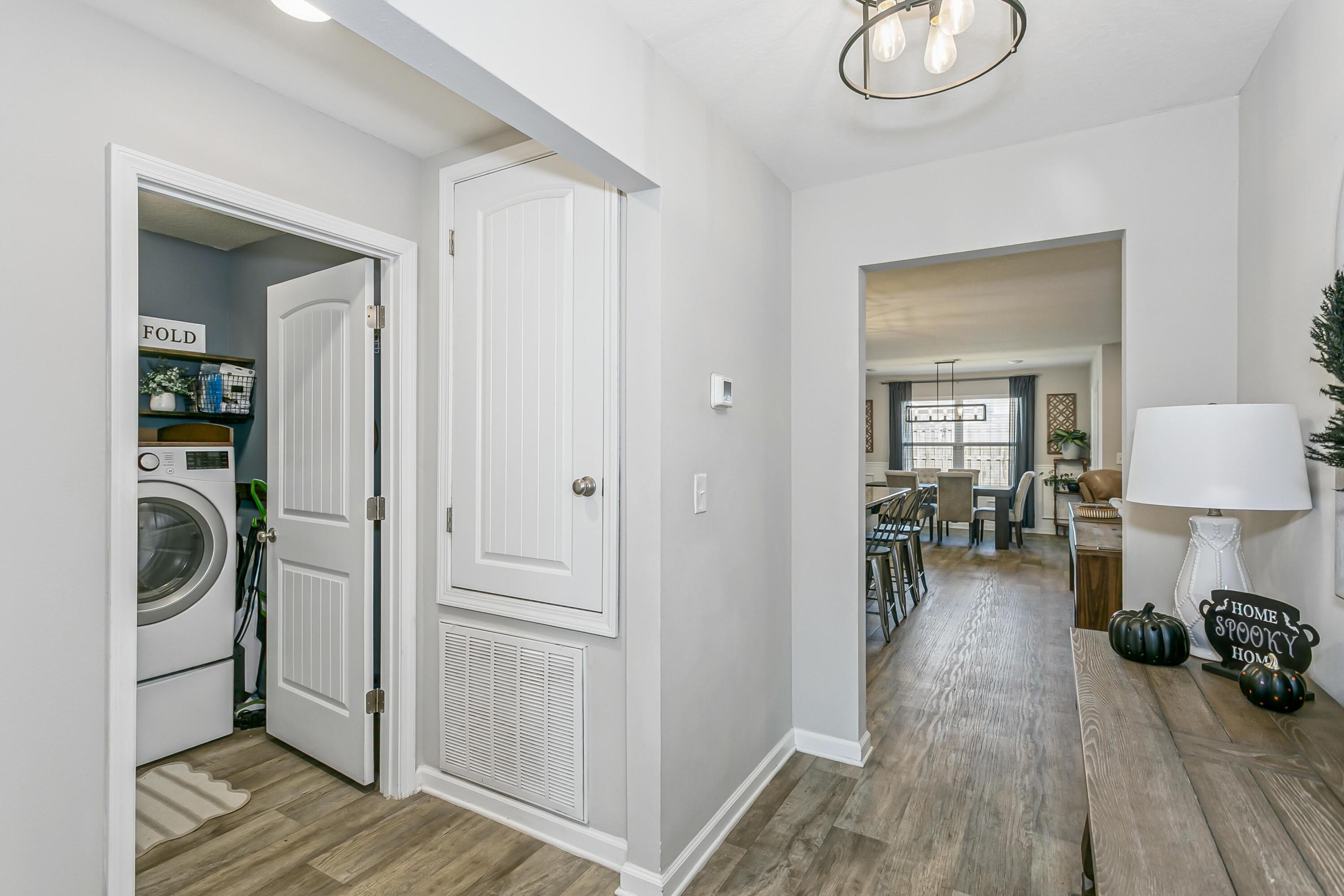 936 Merganser Way Crestview, FL 32539 - Photo 4 of 39 a view of a livingroom and a livingroom with furniture wooden floor cabinet and a bathroom