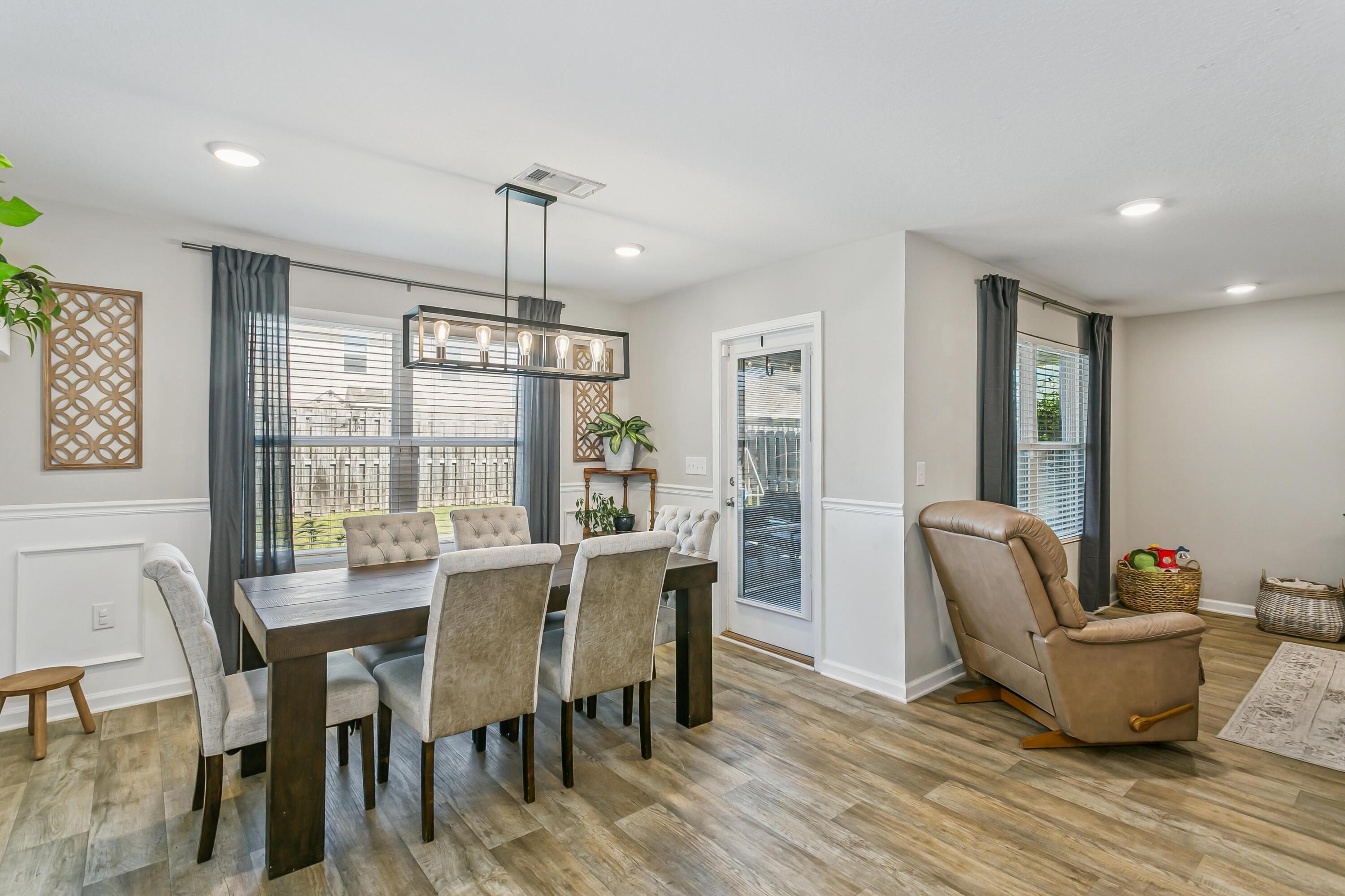 936 Merganser Way Crestview, FL 32539 - Photo 9 of 39 a view of a dining room with furniture window and outside view