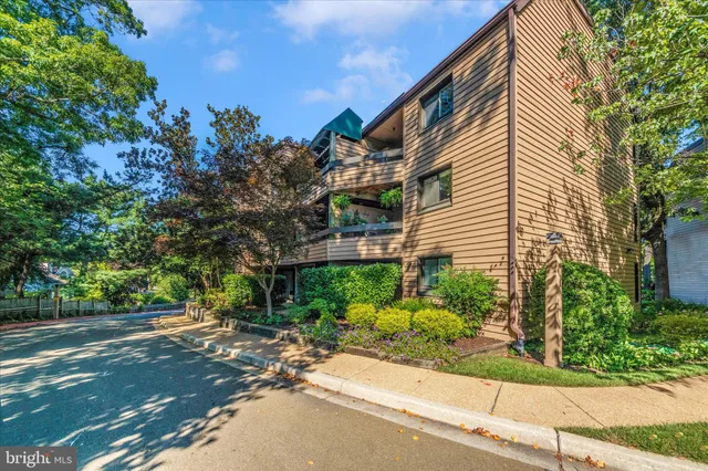 a front view of a building with a yard