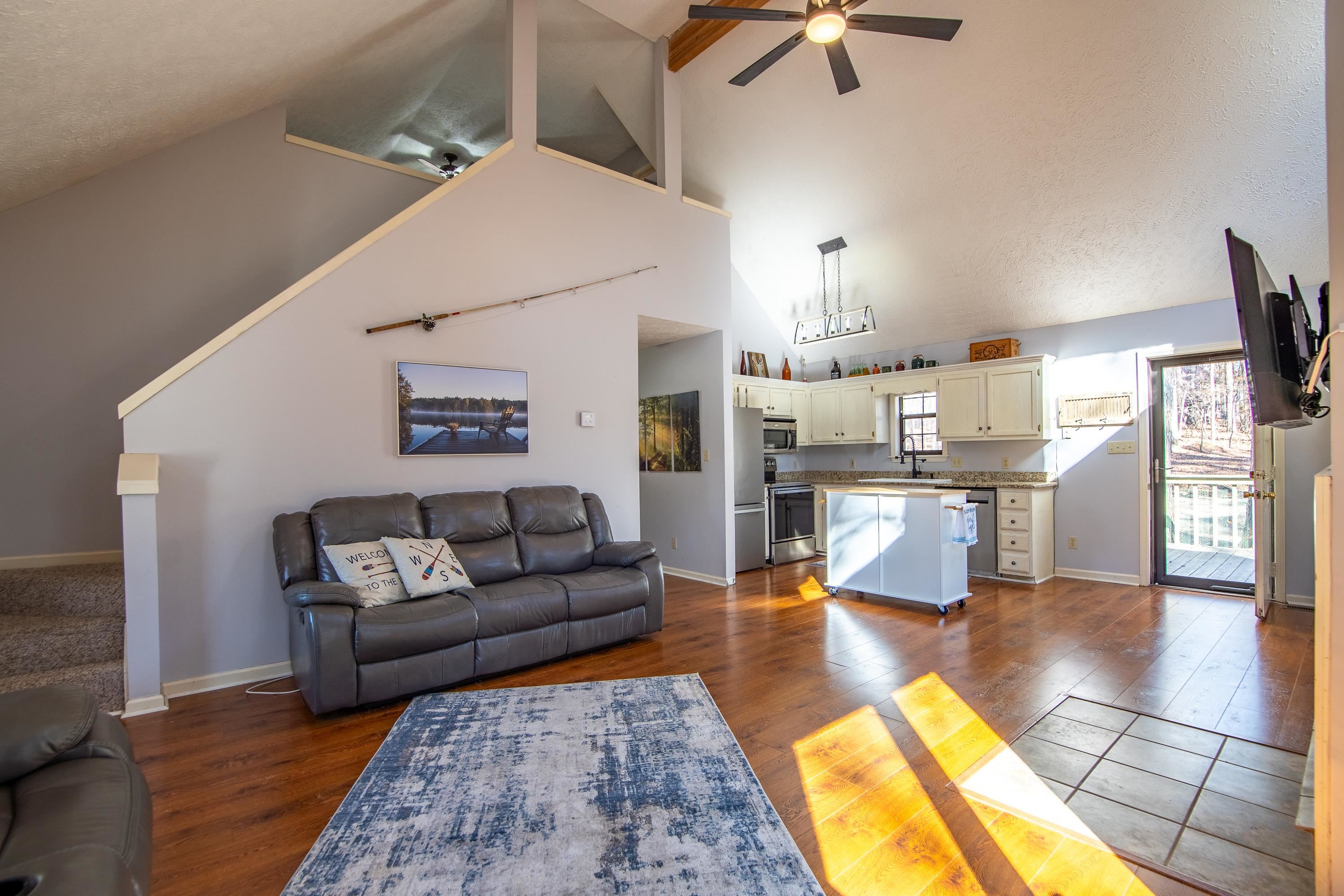 315 Bryson Harbor Road Counce, TN 38326 - Photo 14 of 37 a living room with furniture and a chandelier