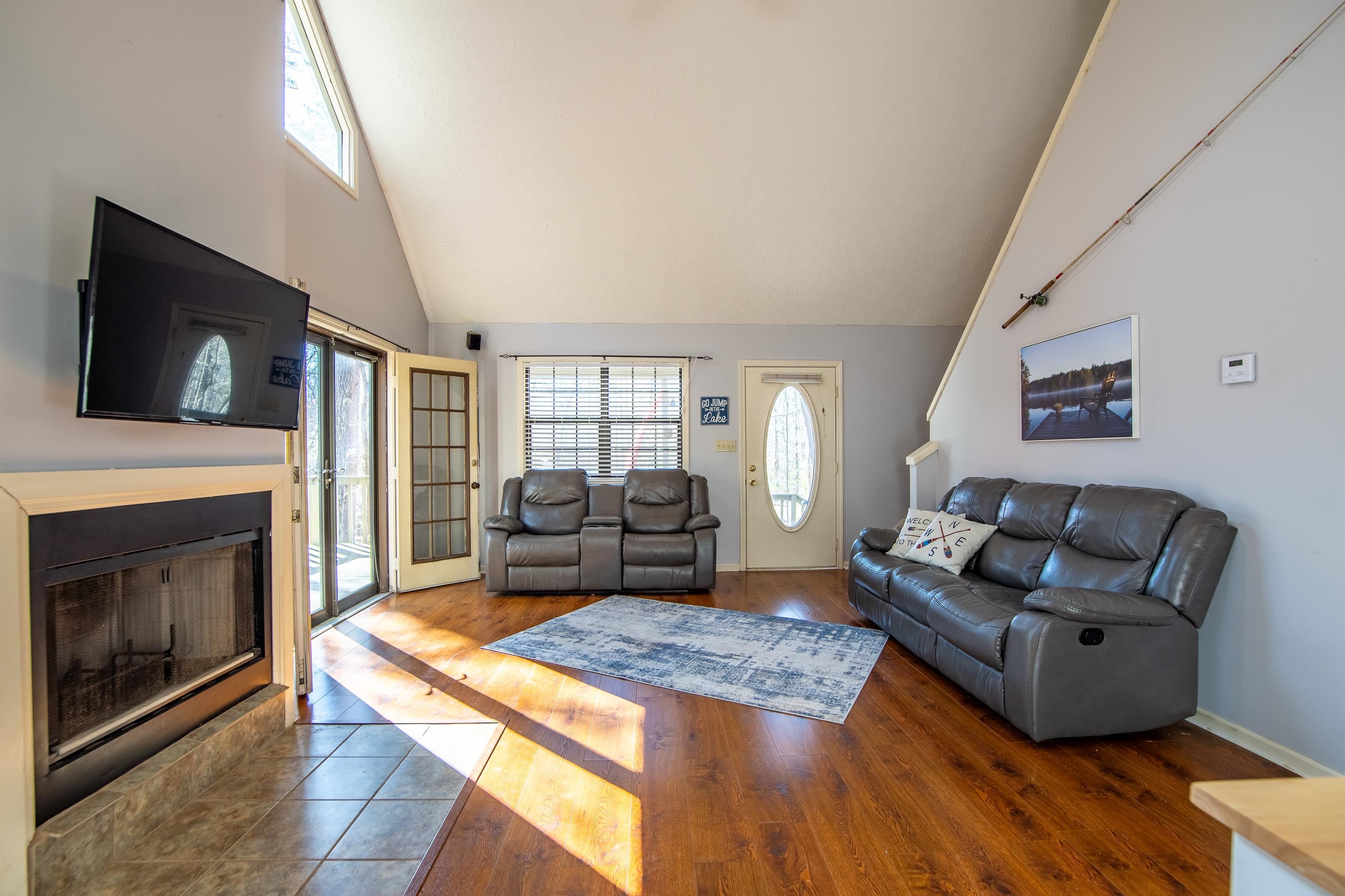 315 Bryson Harbor Road Counce, TN 38326 - Photo 19 of 37 a living room with furniture a flat screen tv and a fireplace