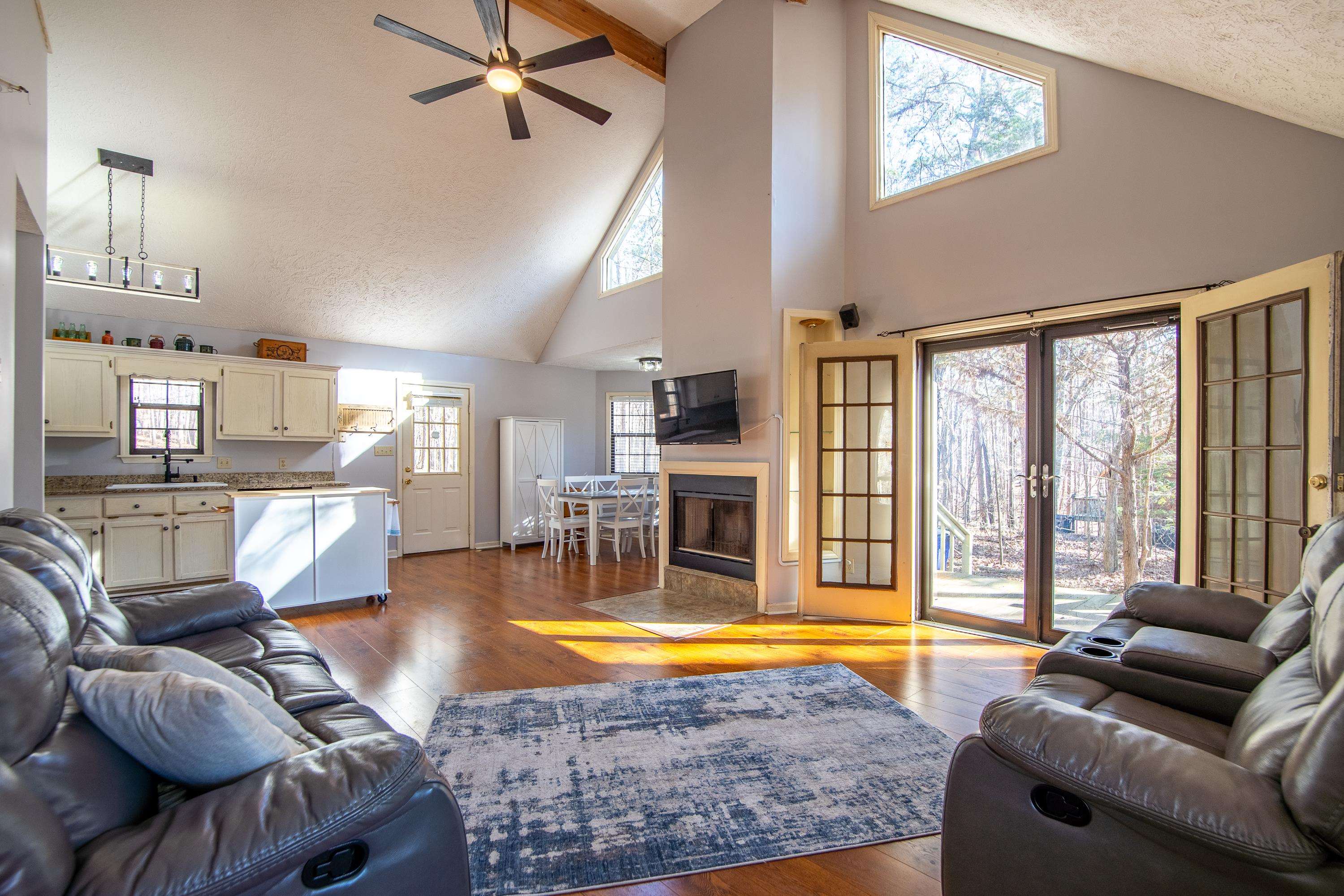 315 Bryson Harbor Road Counce, TN 38326 - Photo 21 of 37 a living room with furniture and a floor to ceiling window