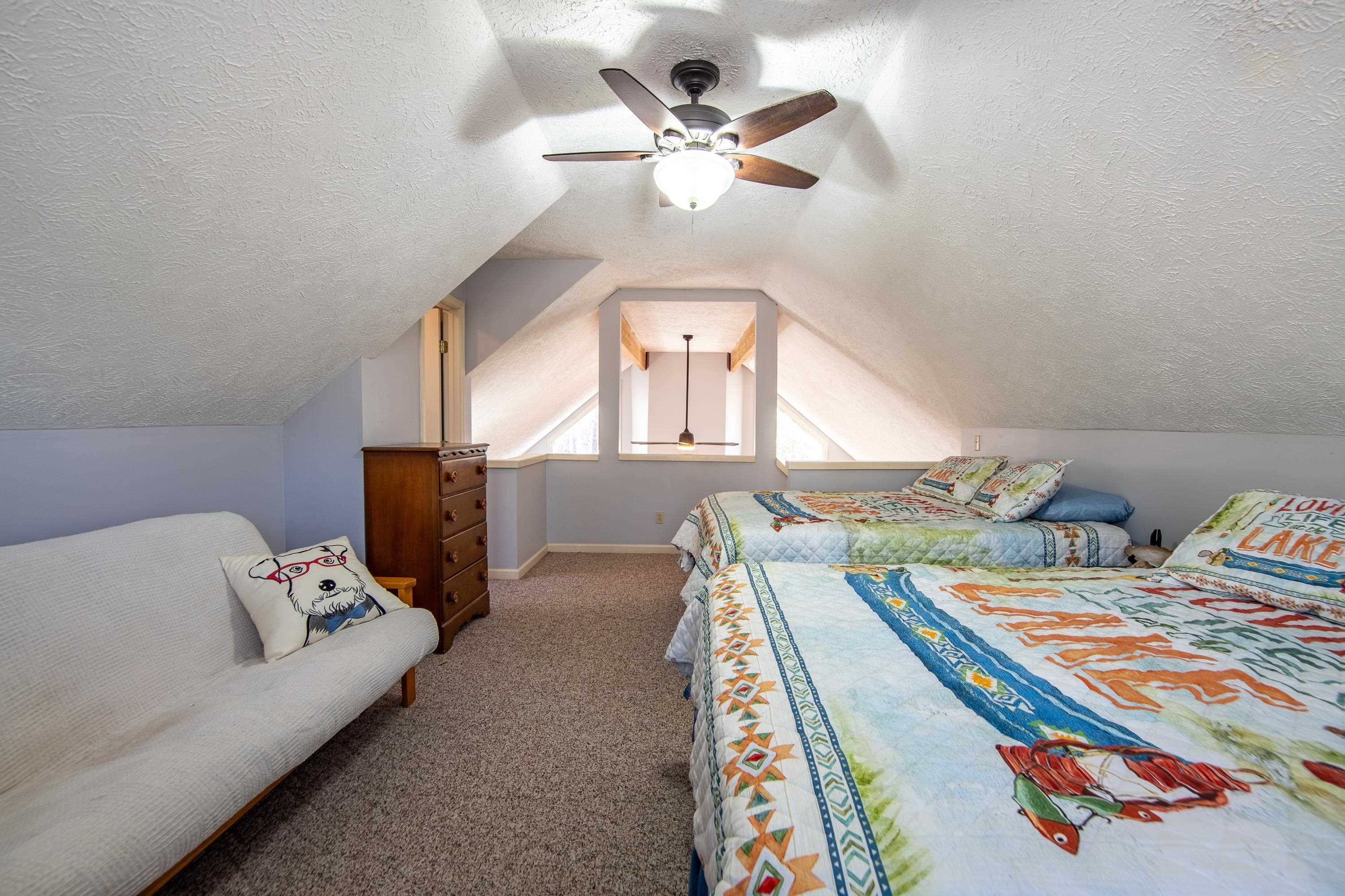 315 Bryson Harbor Road Counce, TN 38326 - Photo 25 of 37 a bed room with bed and a chandelier