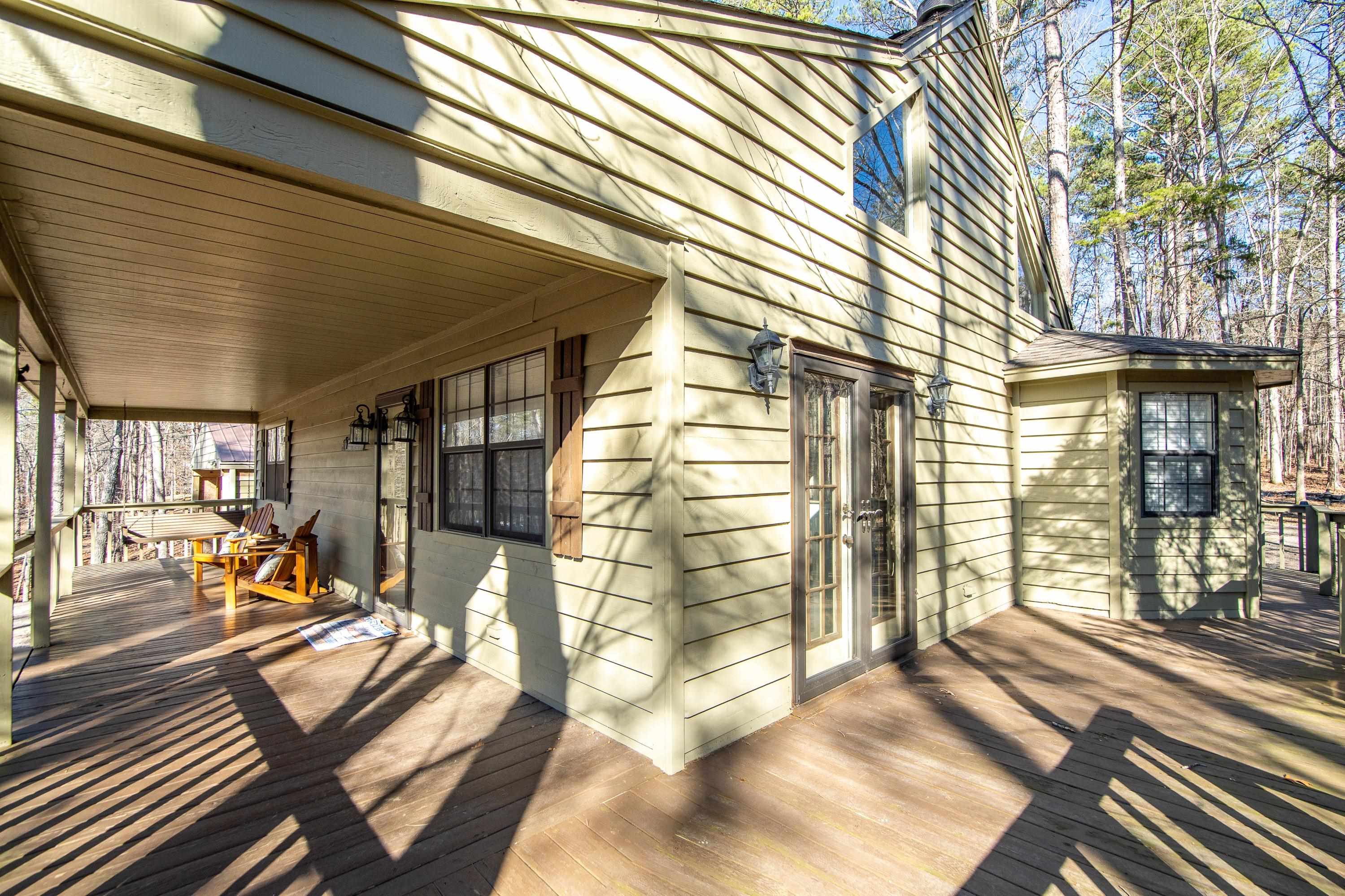 315 Bryson Harbor Road Counce, TN 38326 - Photo 31 of 37 a view of a patio with table and chairs next to window