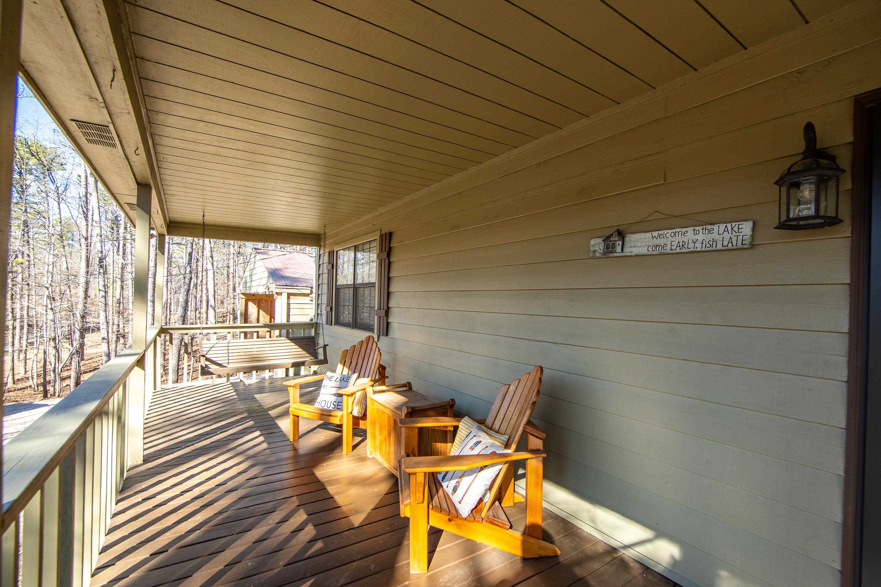 315 Bryson Harbor Road Counce, TN 38326 - Photo 33 of 37 a view of a patio with glass top table and chairs