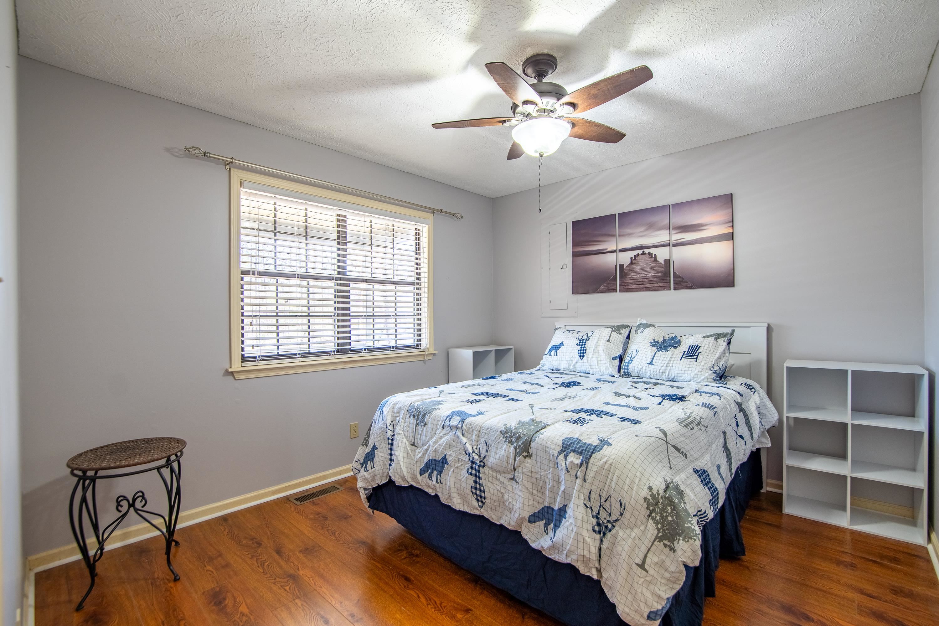 315 Bryson Harbor Road Counce, TN 38326 - Photo 7 of 37 a bedroom with bed and wooden floor