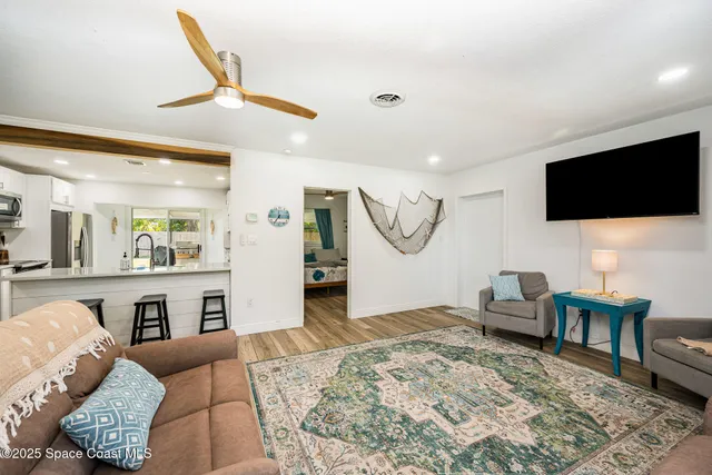 a living room with furniture and a rug