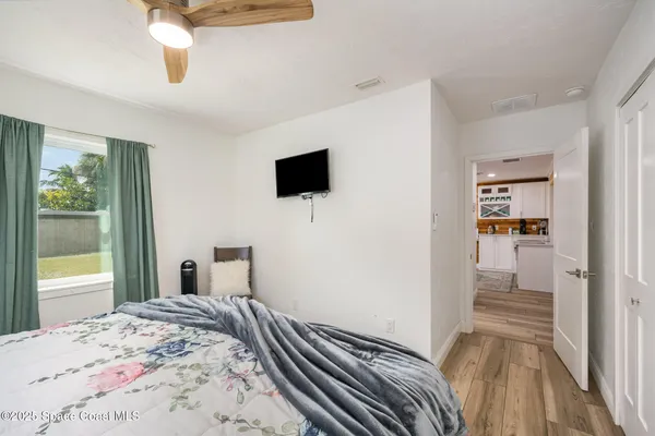 a bedroom with a bed and chair