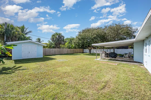 a patio with a table and chairs