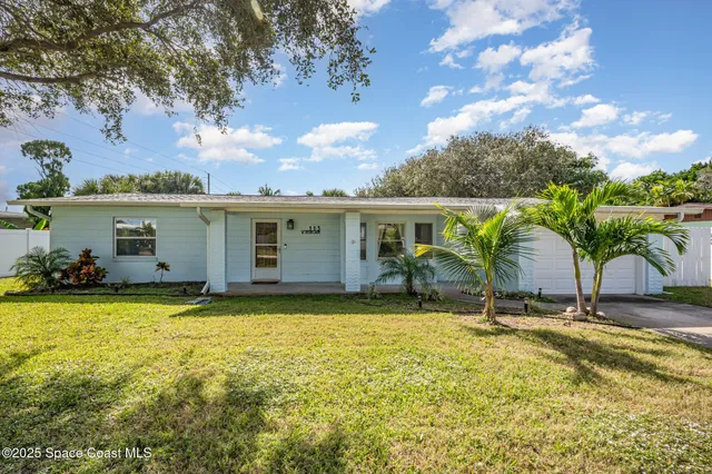 a view of a house with swimming pool and a yard