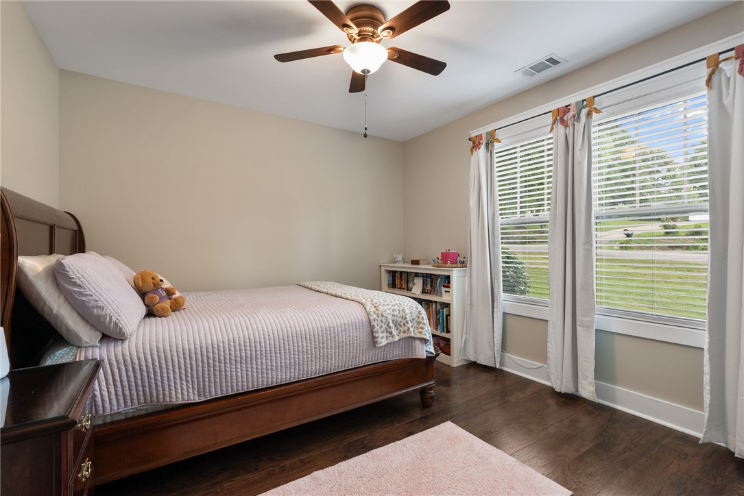 201 Hearthstone Drive Anderson, SC 29621 - Photo 25 of 49 Hardwood floors and generous natural light define this cozy bedroom retreat.