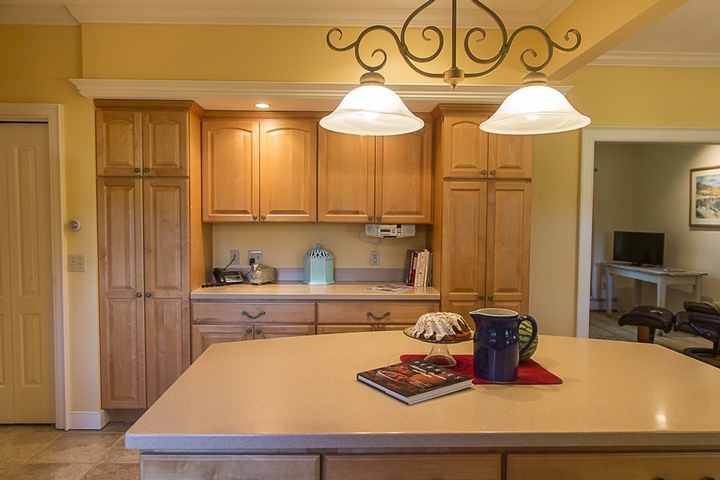 72 Old Stage Road Montague, MA 01351 - Photo 14 of 23 a kitchen with stainless steel appliances granite countertop a sink dishwasher and cabinets with wooden floor