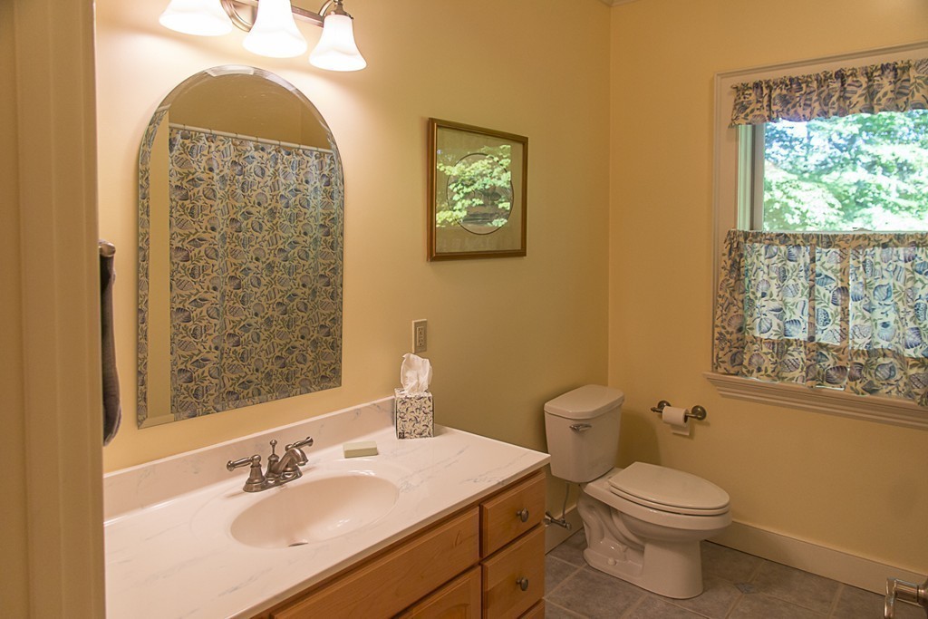 72 Old Stage Road Montague, MA 01351 - Photo 20 of 23 a bathroom with a toilet a sink and mirror