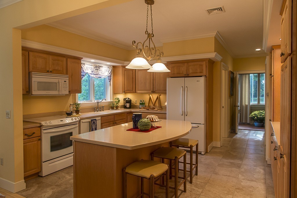 72 Old Stage Road Montague, MA 01351 - Photo 8 of 23 a kitchen with a table chairs stove and refrigerator