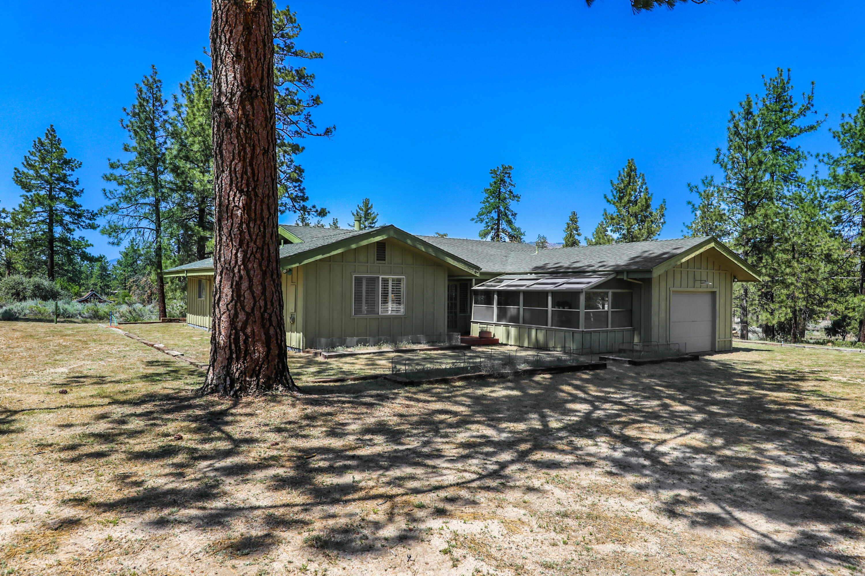 59672 Hop Patch Spring Road Mountain Center, CA 92561 - Photo 2 of 38 a view of a house with a yard