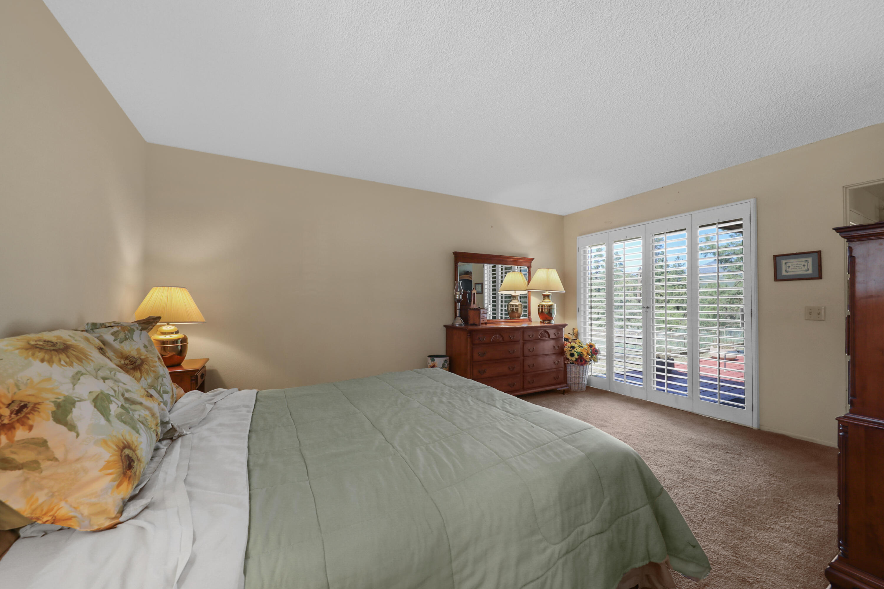 59672 Hop Patch Spring Road Mountain Center, CA 92561 - Photo 21 of 38 a bedroom with a bed and a large window