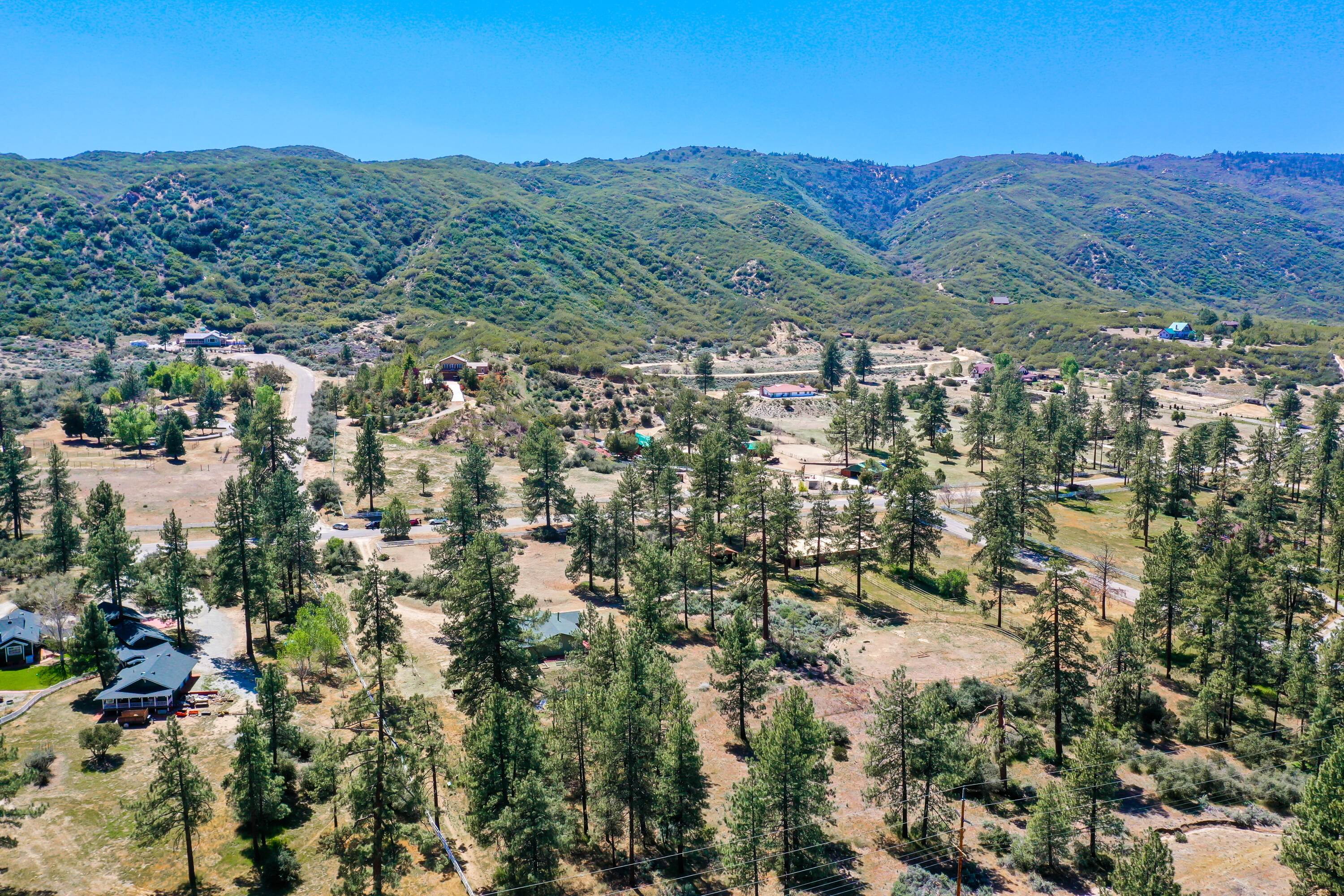 59672 Hop Patch Spring Road Mountain Center, CA 92561 - Photo 32 of 38 a view of a city with mountains in the background