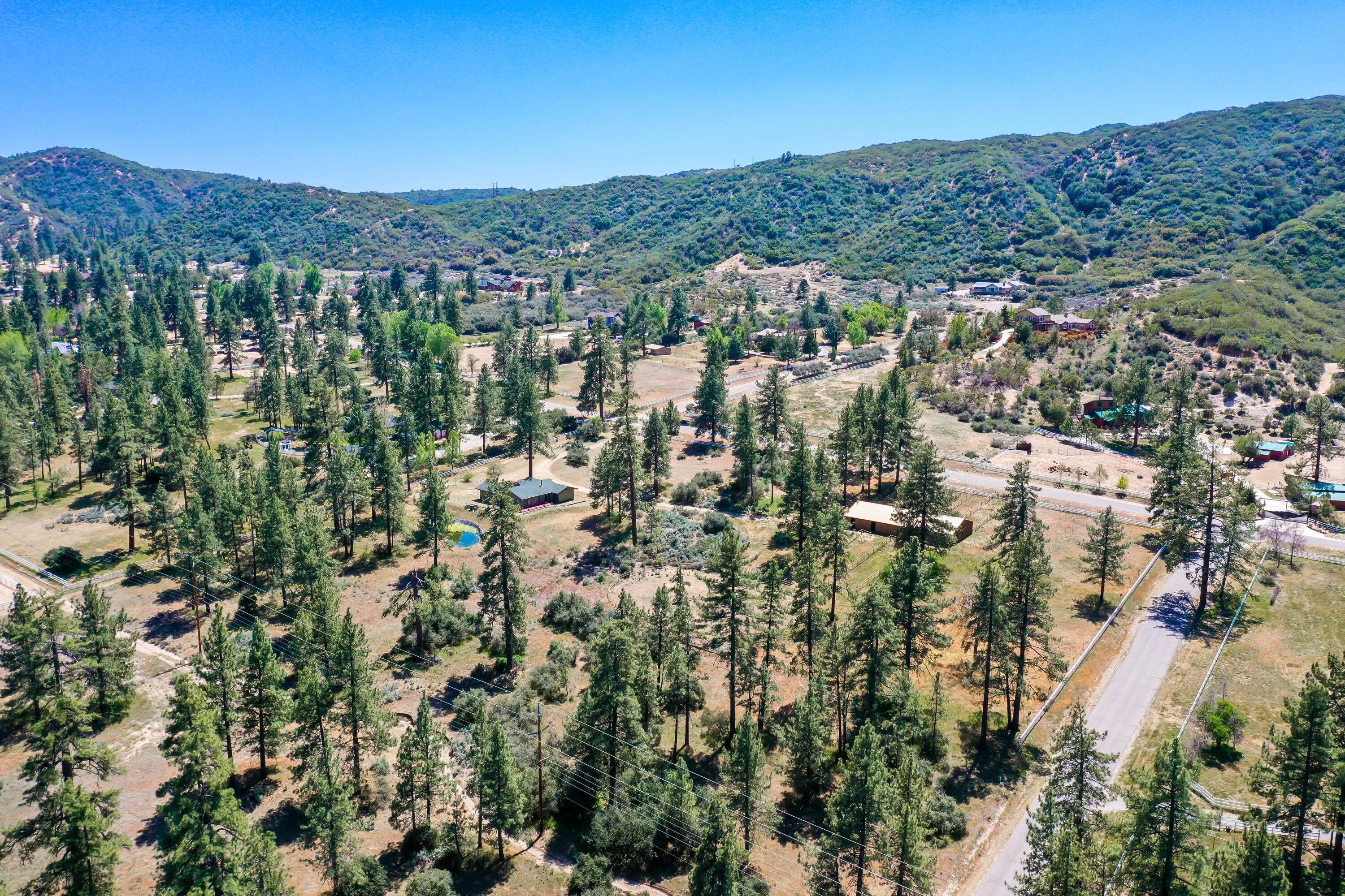 59672 Hop Patch Spring Road Mountain Center, CA 92561 - Photo 34 of 38 an aerial view of residential houses with outdoor space and trees