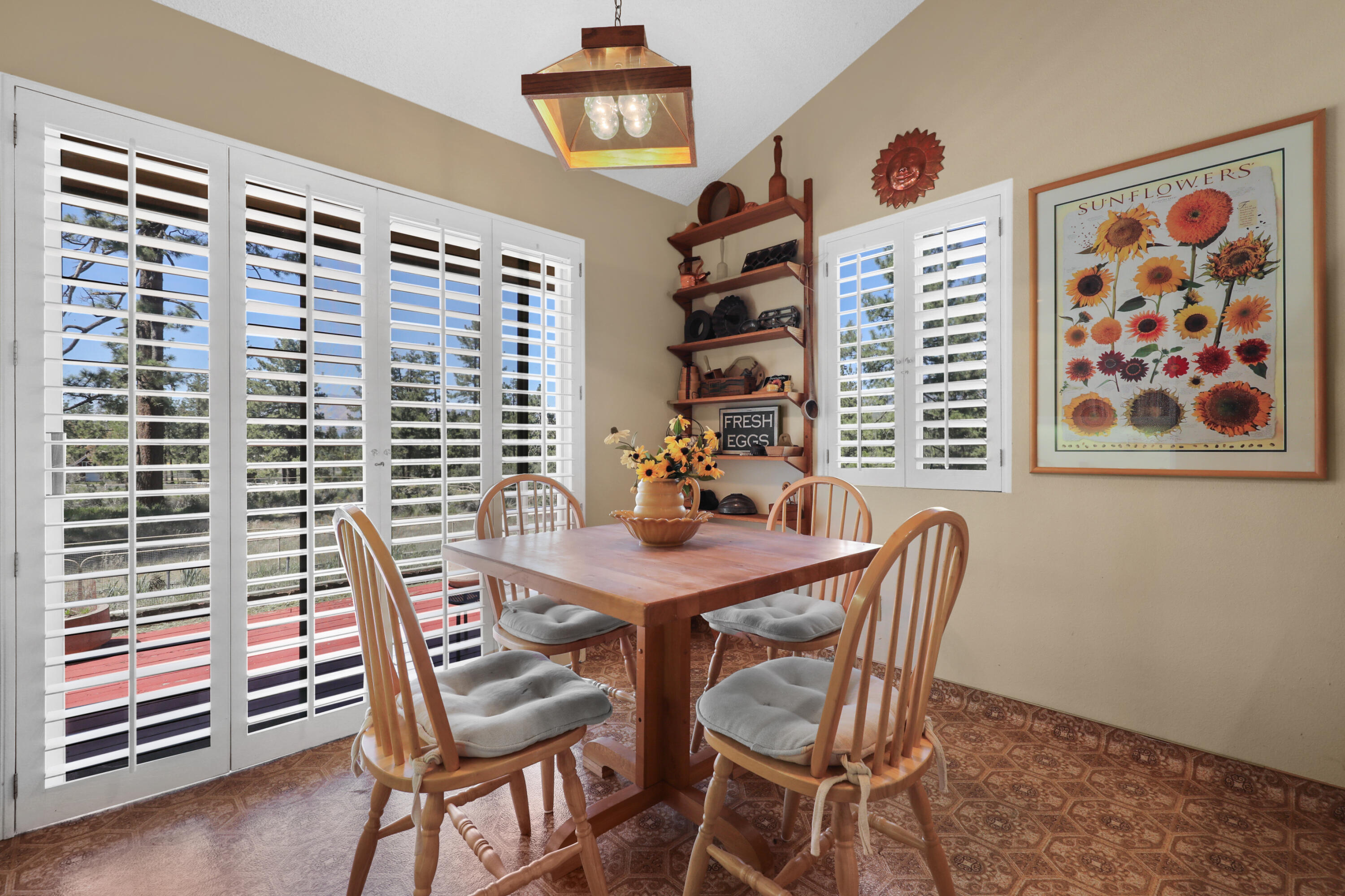 59672 Hop Patch Spring Road Mountain Center, CA 92561 - Photo 10 of 38 a view of a dining room with furniture and chandelier