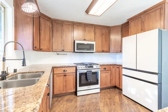 a view of a livingroom with a ceiling fan and window