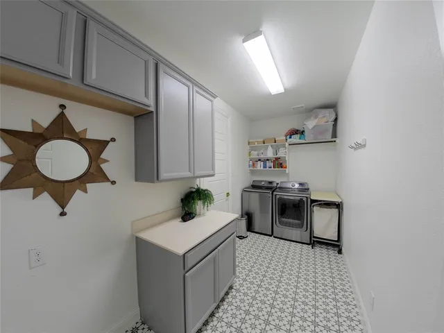 a kitchen with a sink cabinets and appliances