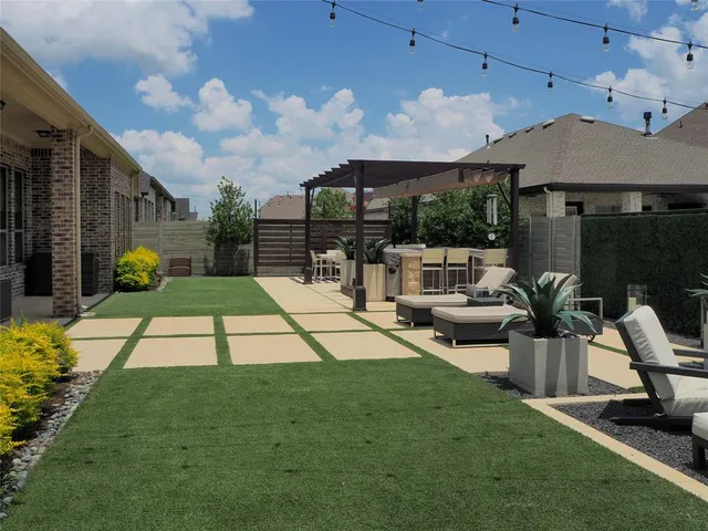 a view of a backyard with sitting area