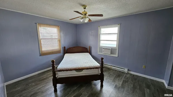 a room with table chair and window