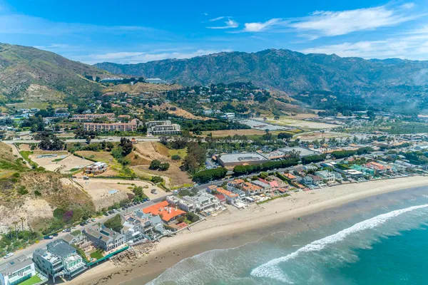a kitchen with a sink and a refrigerator