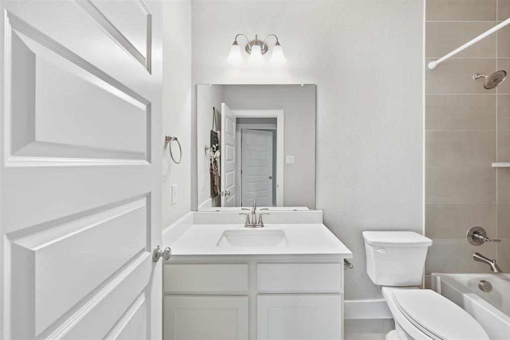 5805 Heatherwood Loop Sachse, TX 75048 - Photo 39 of 39 a bathroom with a sink toilet and shower