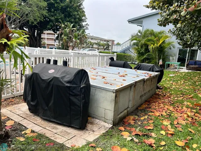 a backyard of a house with large trees
