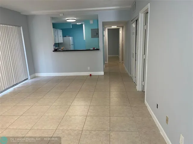 an empty room with a bathroom