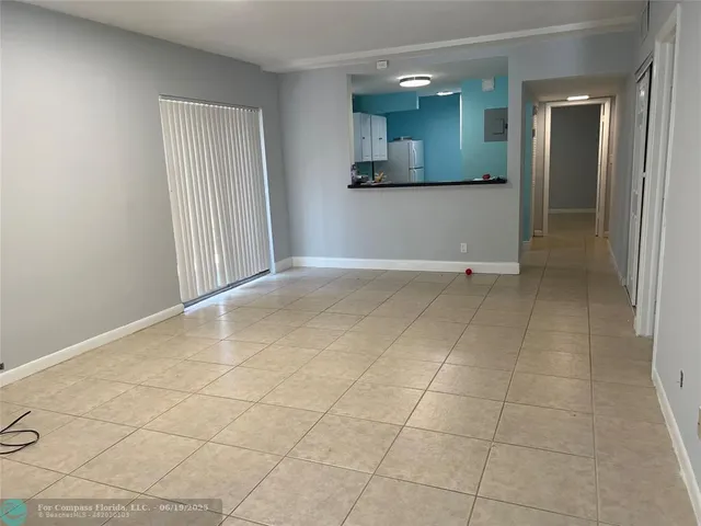 a view of a kitchen from the hallway